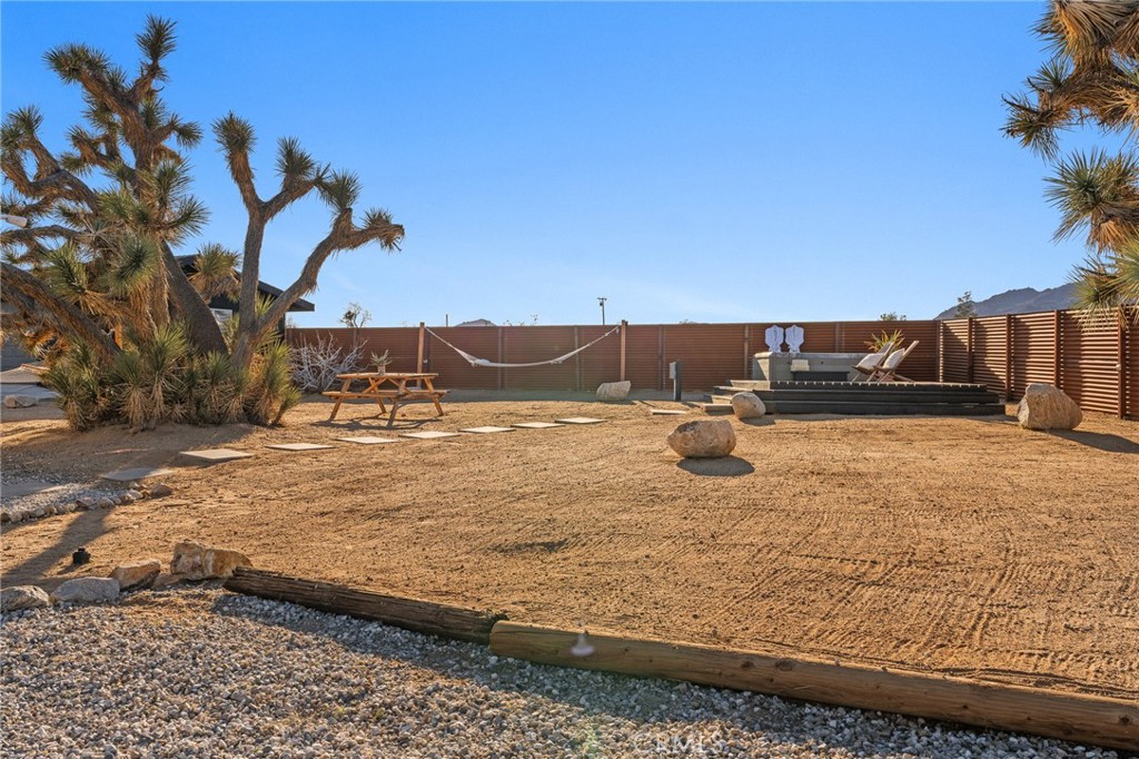 4212 Oneill Road Joshua Tree, CA 92252 - Photo 37 of 60 a view of a backyard of the house