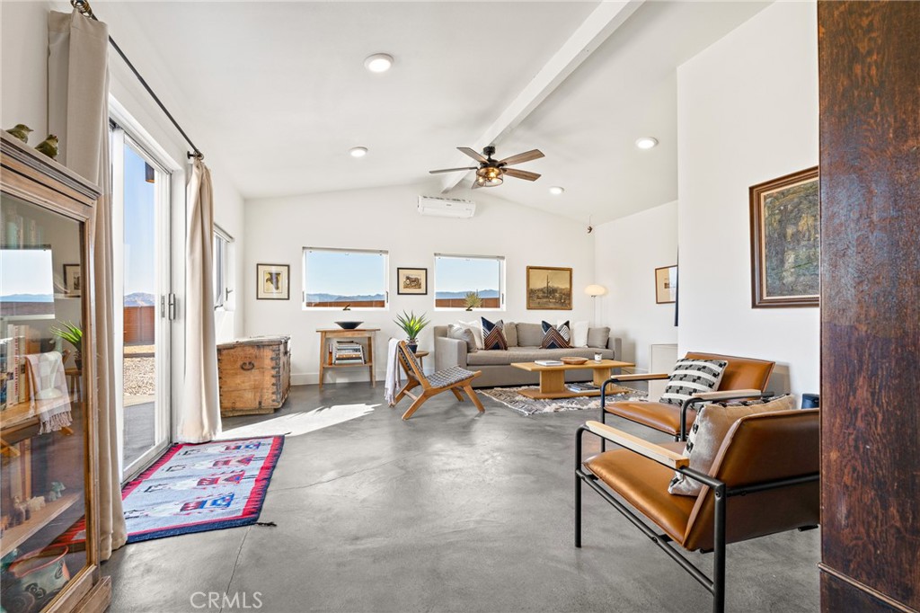 4212 Oneill Road Joshua Tree, CA 92252 - Photo 4 of 60 a living room with furniture ceiling fan and a rug