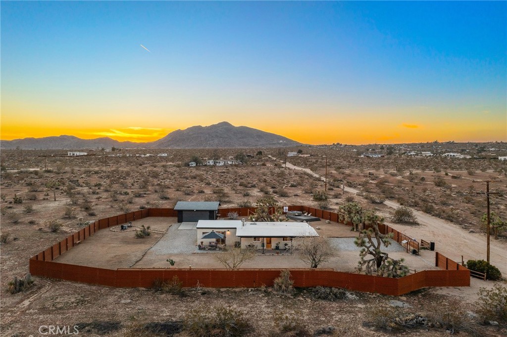 4212 Oneill Road Joshua Tree, CA 92252 - Photo 48 of 60 a view of a town with mountains in the background