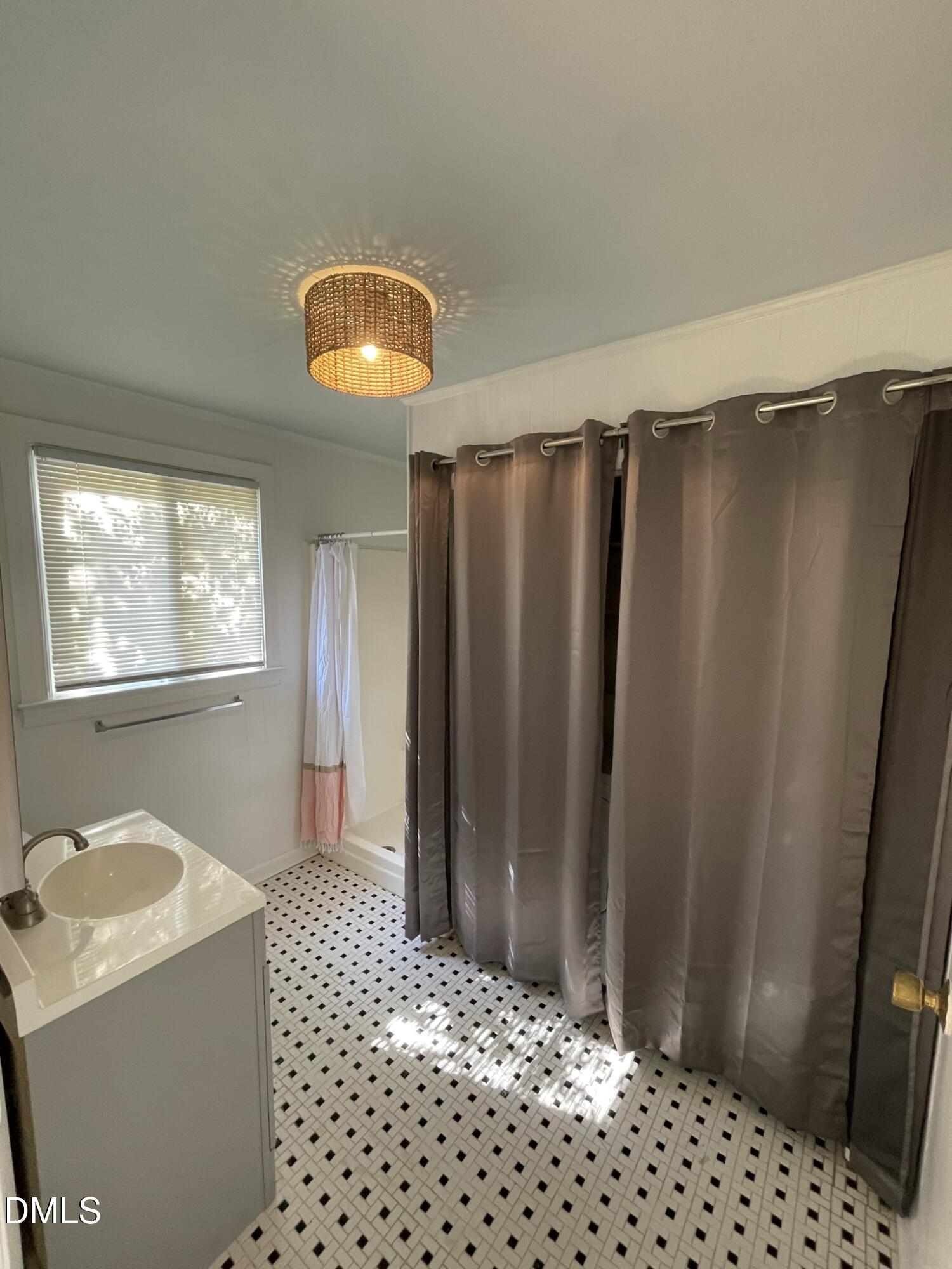 1009 Canterbury Road Raleigh, NC 27607 - Photo 22 of 31 a bedroom with a bed and a window
