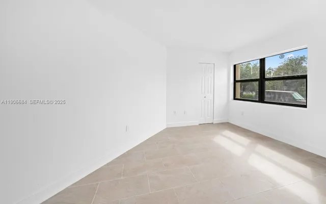 an empty room with windows