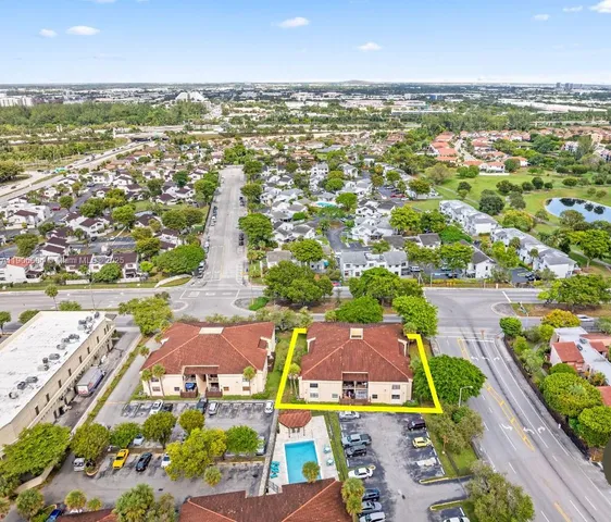 an aerial view of residential houses with outdoor space
