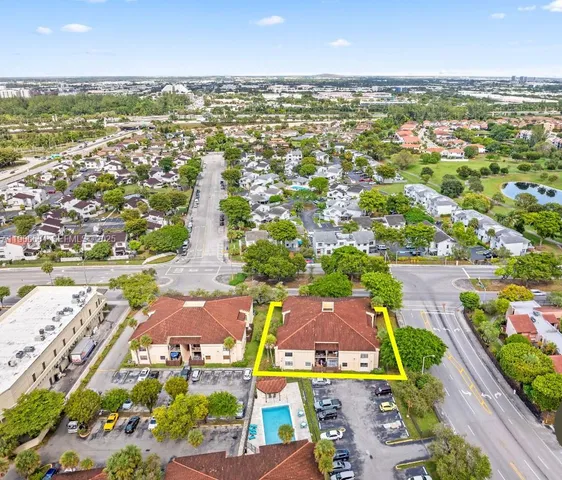 an aerial view of residential houses with outdoor space