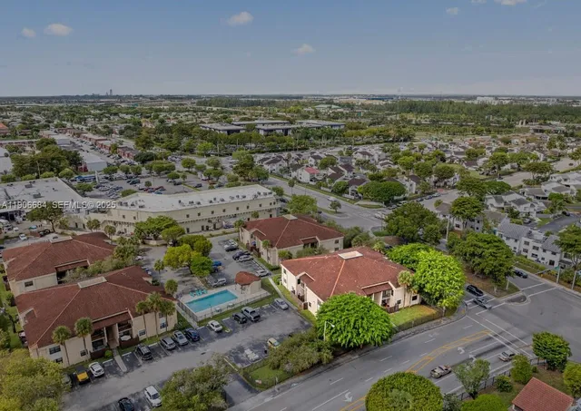 an aerial view of a houses with a outdoor space