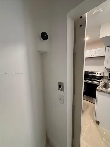 a view of a kitchen from the hallway