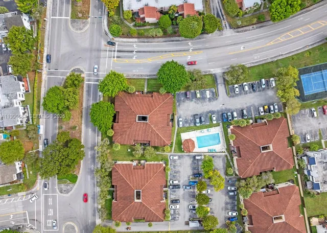 an aerial view of residential houses and outdoor space