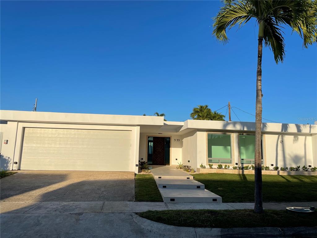333 Cordoba Guaynabo, PR 00966 - Photo 1 of 1 a front view of a house with garden