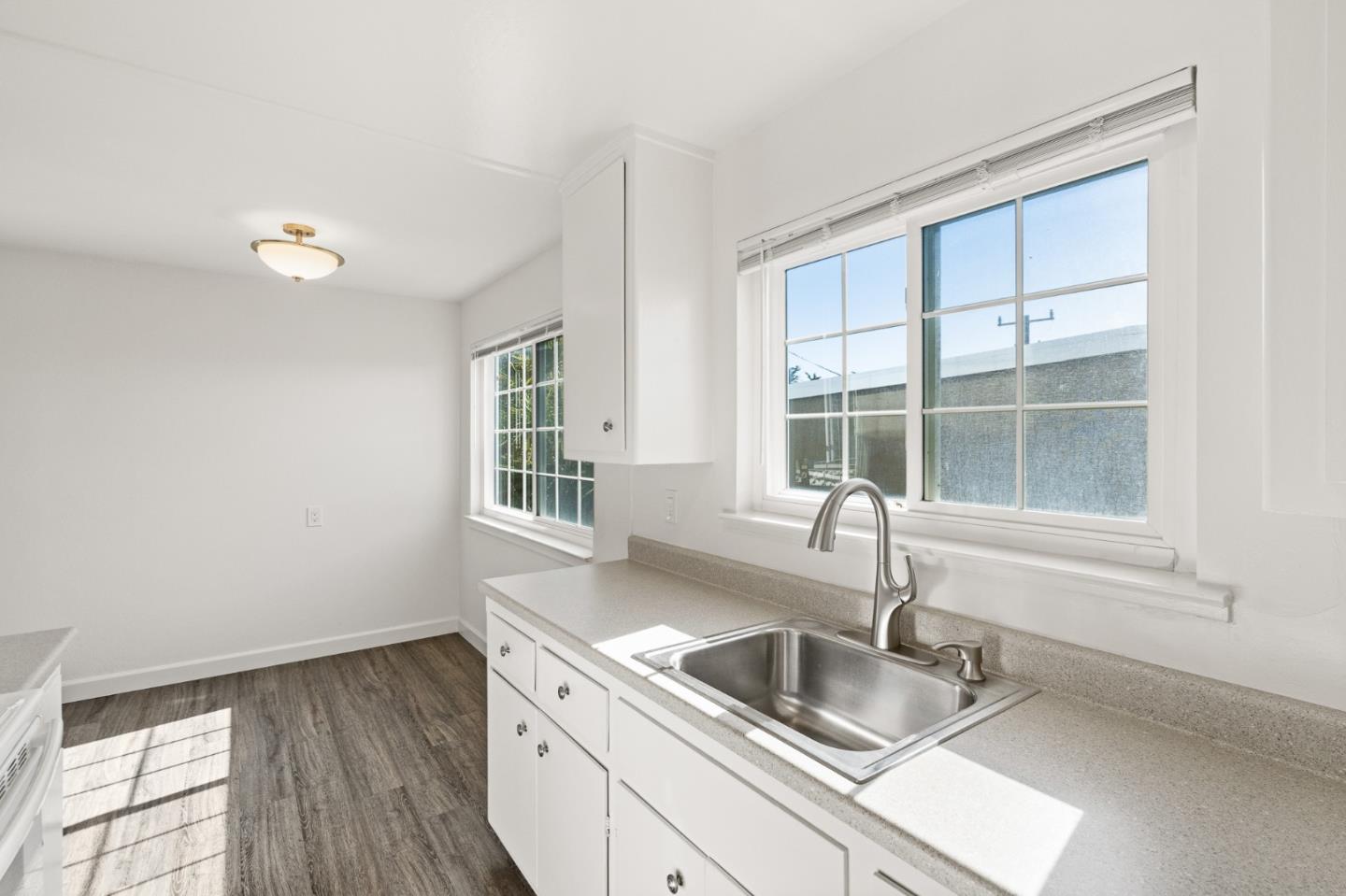127 Hilton Way Pacifica, CA 94044 - Photo 14 of 18 a kitchen with granite countertop a sink and a window
