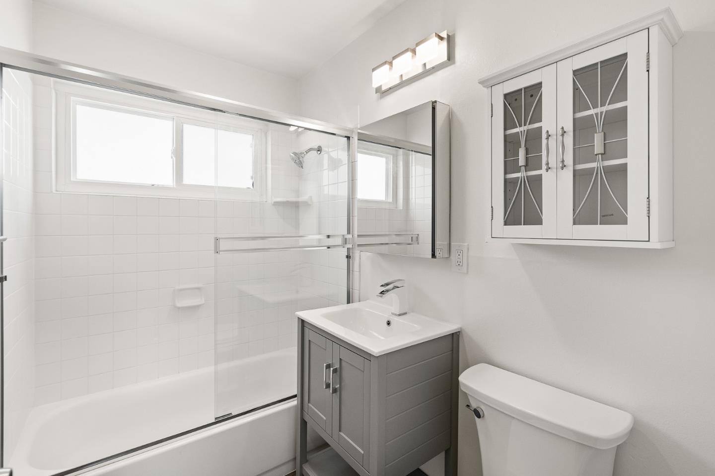 127 Hilton Way Pacifica, CA 94044 - Photo 17 of 18 a bathroom with a sink toilet and shower