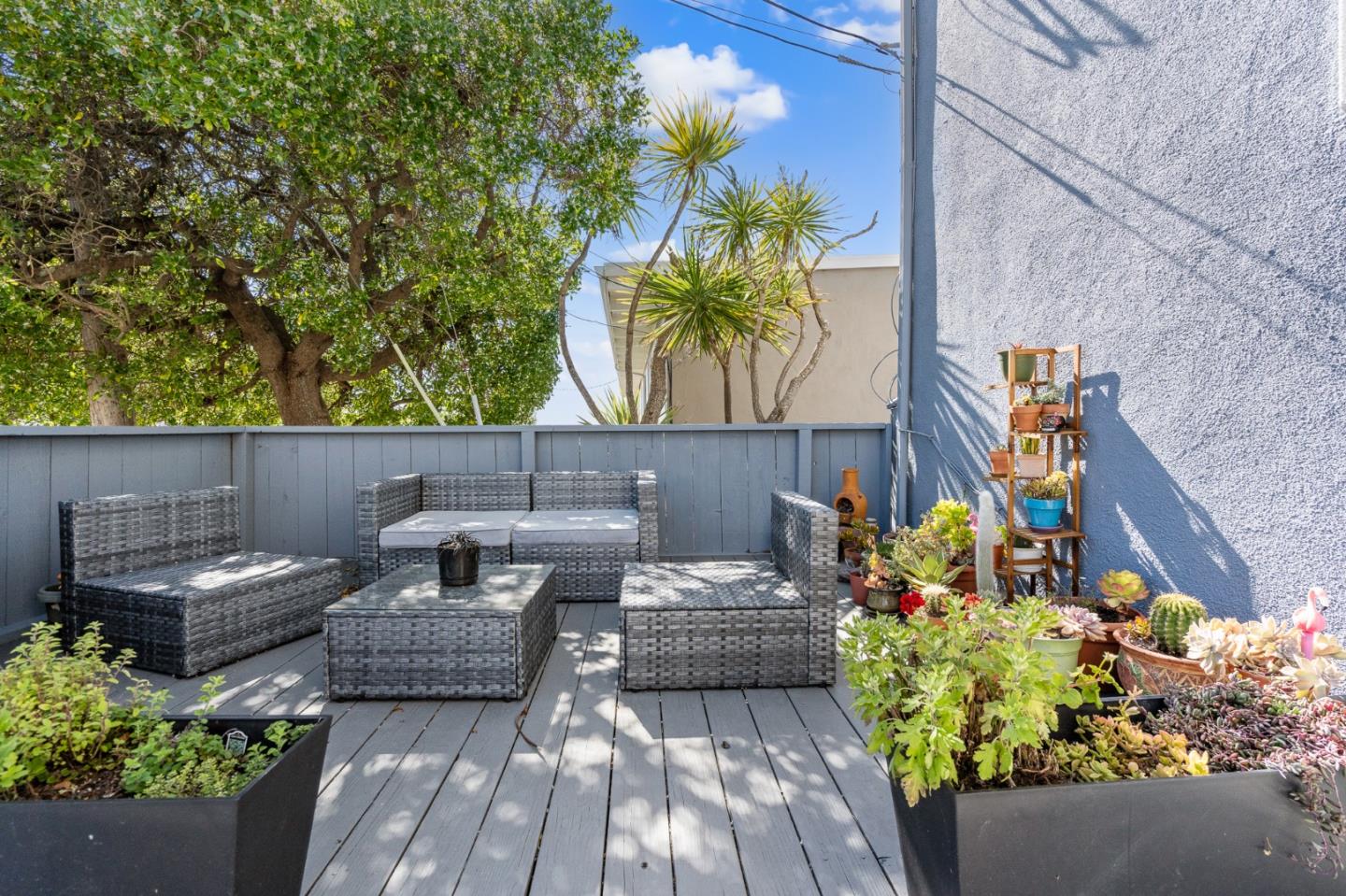 127 Hilton Way Pacifica, CA 94044 - Photo 5 of 18 a backyard of a house with lots of green space and seating