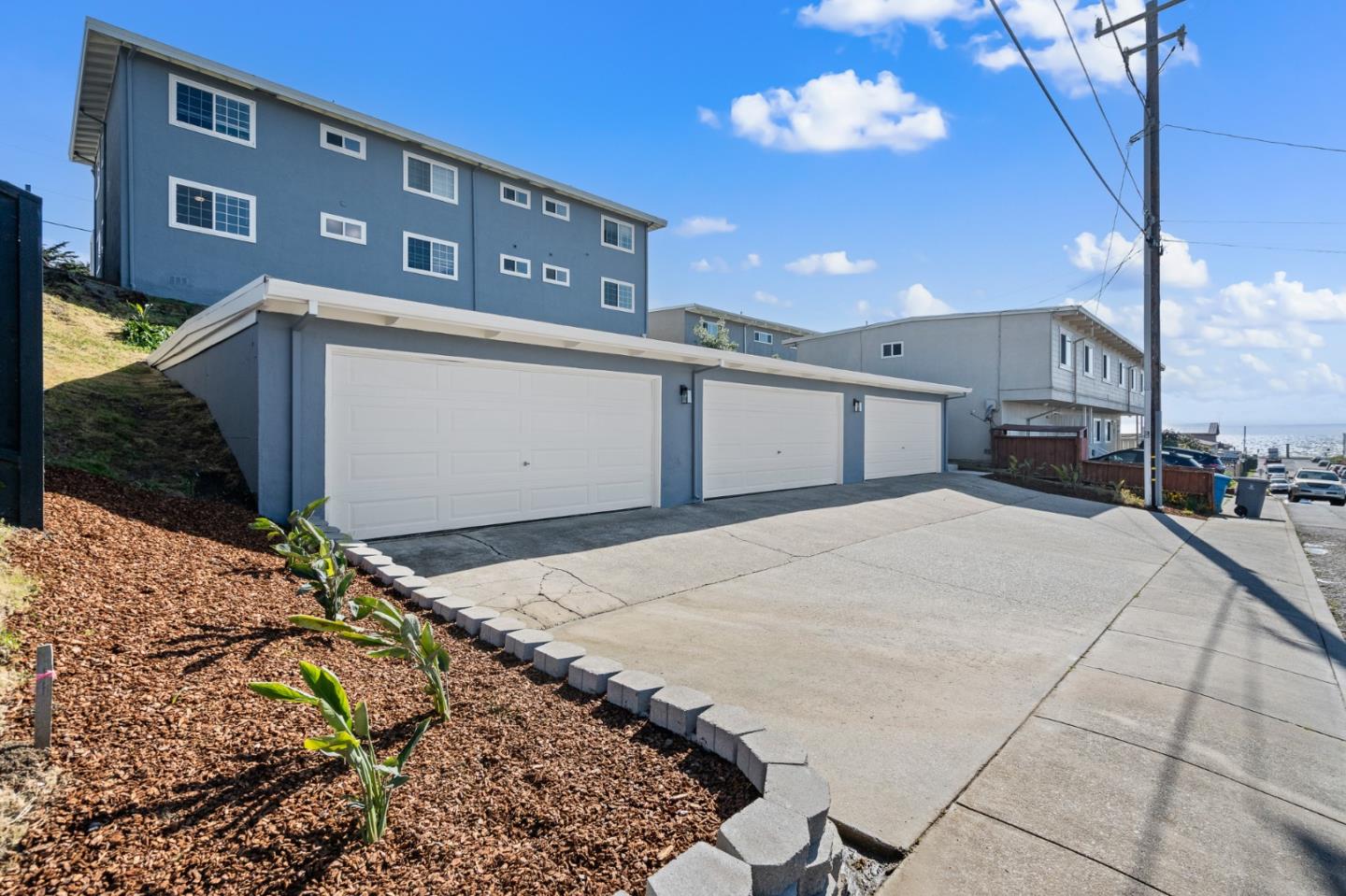 127 Hilton Way Pacifica, CA 94044 - Photo 7 of 18 a front view of a house with a yard
