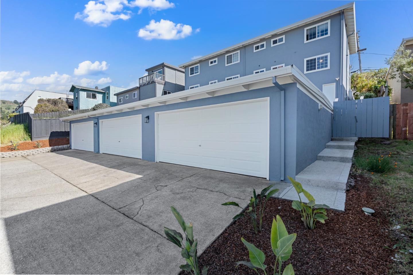 127 Hilton Way Pacifica, CA 94044 - Photo 8 of 18 a view of a house with a space and a garage