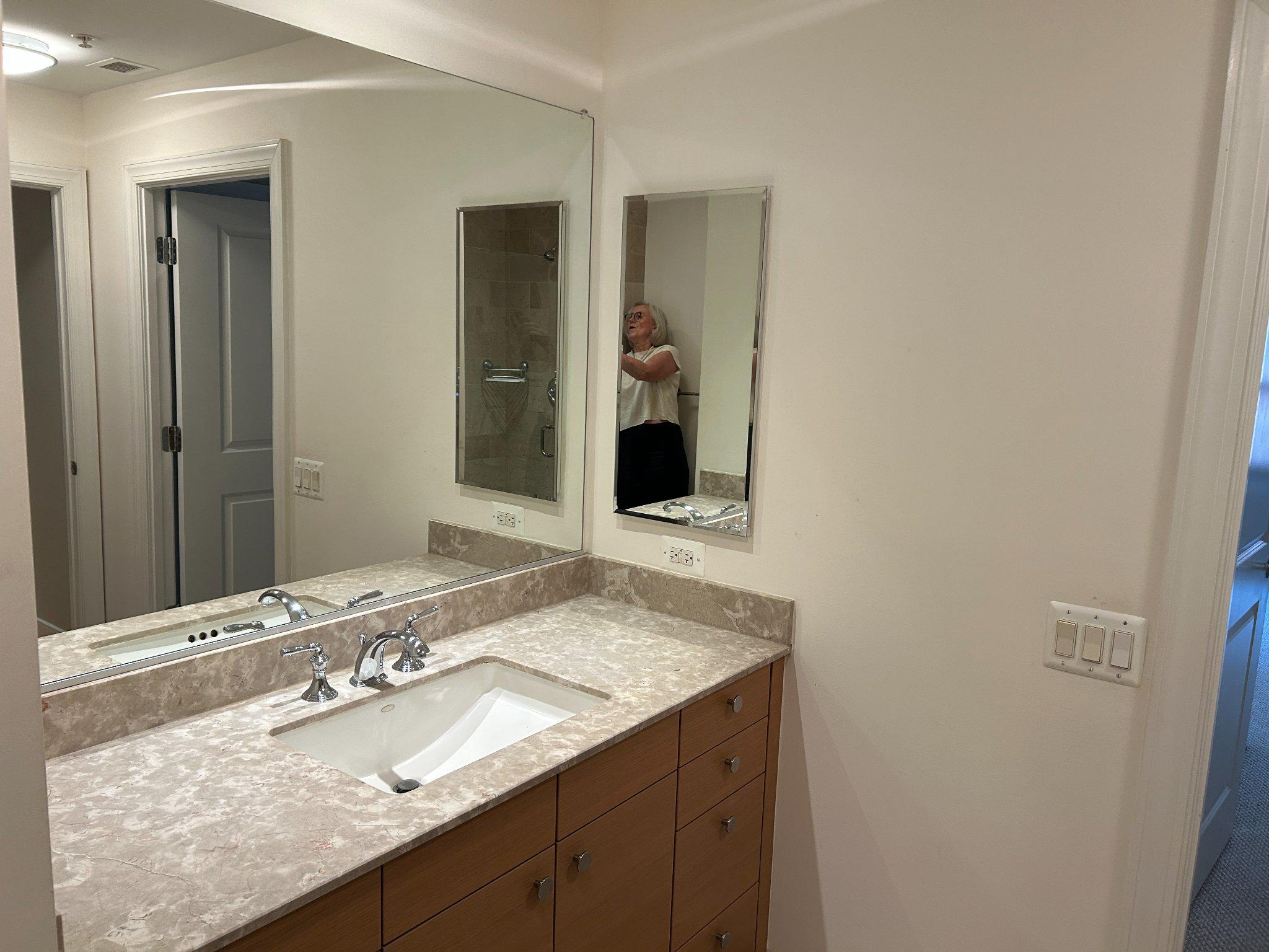 2425 L Street Northwest, Unit 421 Washington, DC 20037 - Photo 13 of 18 Modern bathroom with large mirror.