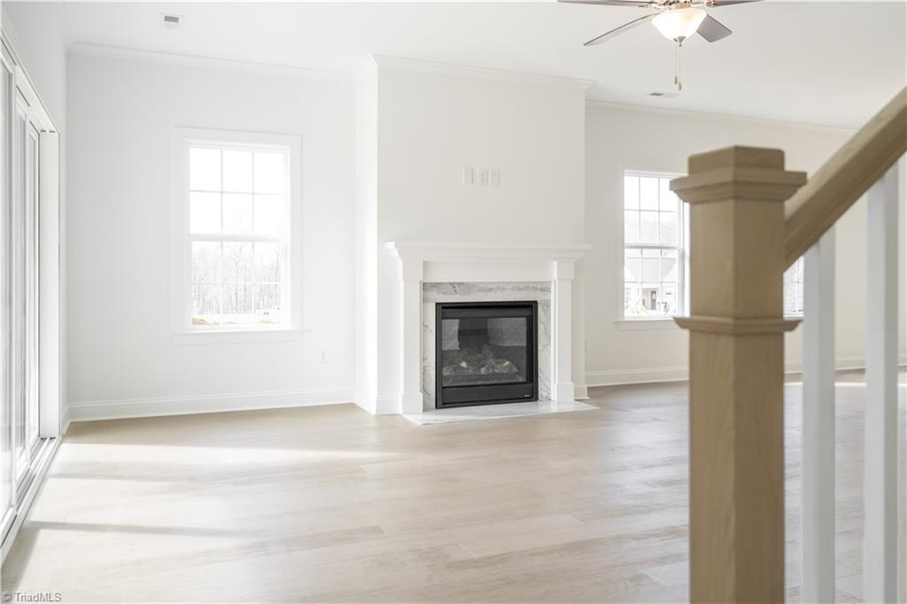 2051 Welden Ridge Road Kernersville, NC 27284 - Photo 12 of 50 Upgraded Fireplace & Wood Stairs going to 2nd floor