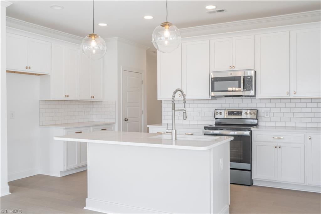 2051 Welden Ridge Road Kernersville, NC 27284 - Photo 14 of 50 Kitchen with Quartz Countertops