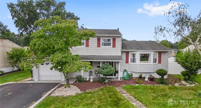 a house view with a sitting space and garden