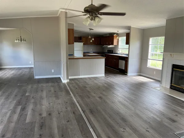 a view of a kitchen with a sink and a stove top oven