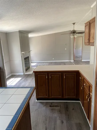 a kitchen with a sink a stove and cabinets