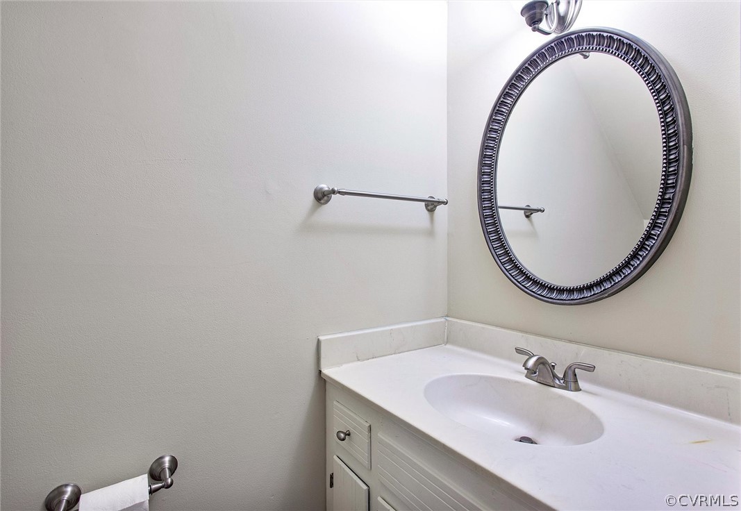 14000 Turtle Hill Road Midlothian, VA 23112 - Photo 19 of 37 a bathroom with a sink and a mirror