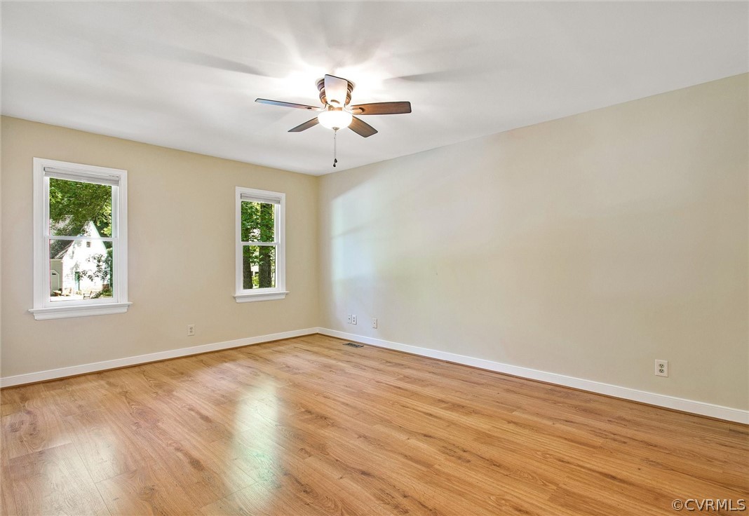 14000 Turtle Hill Road Midlothian, VA 23112 - Photo 20 of 37 a view of an empty room with window and wooden floor