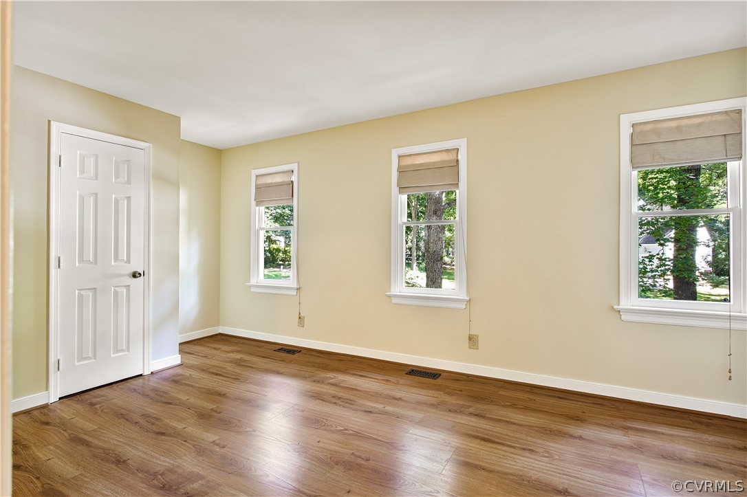 14000 Turtle Hill Road Midlothian, VA 23112 - Photo 23 of 37 a view of an empty room with wooden floor and a window