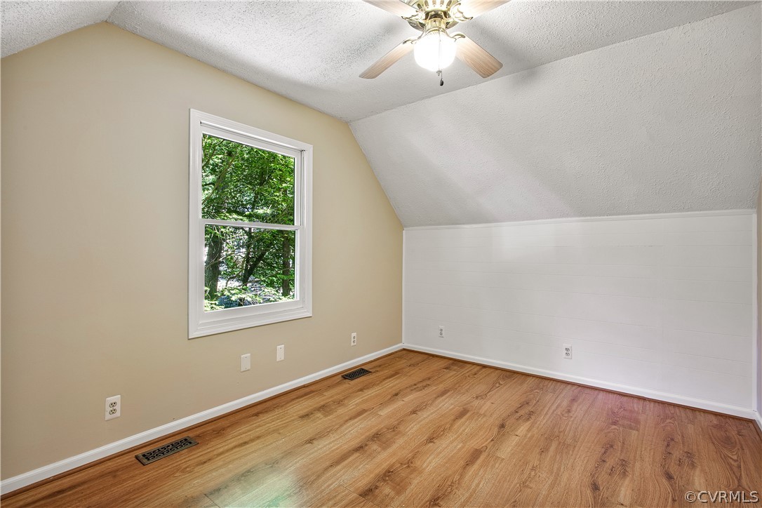14000 Turtle Hill Road Midlothian, VA 23112 - Photo 25 of 37 an empty room with a window and wooden floor