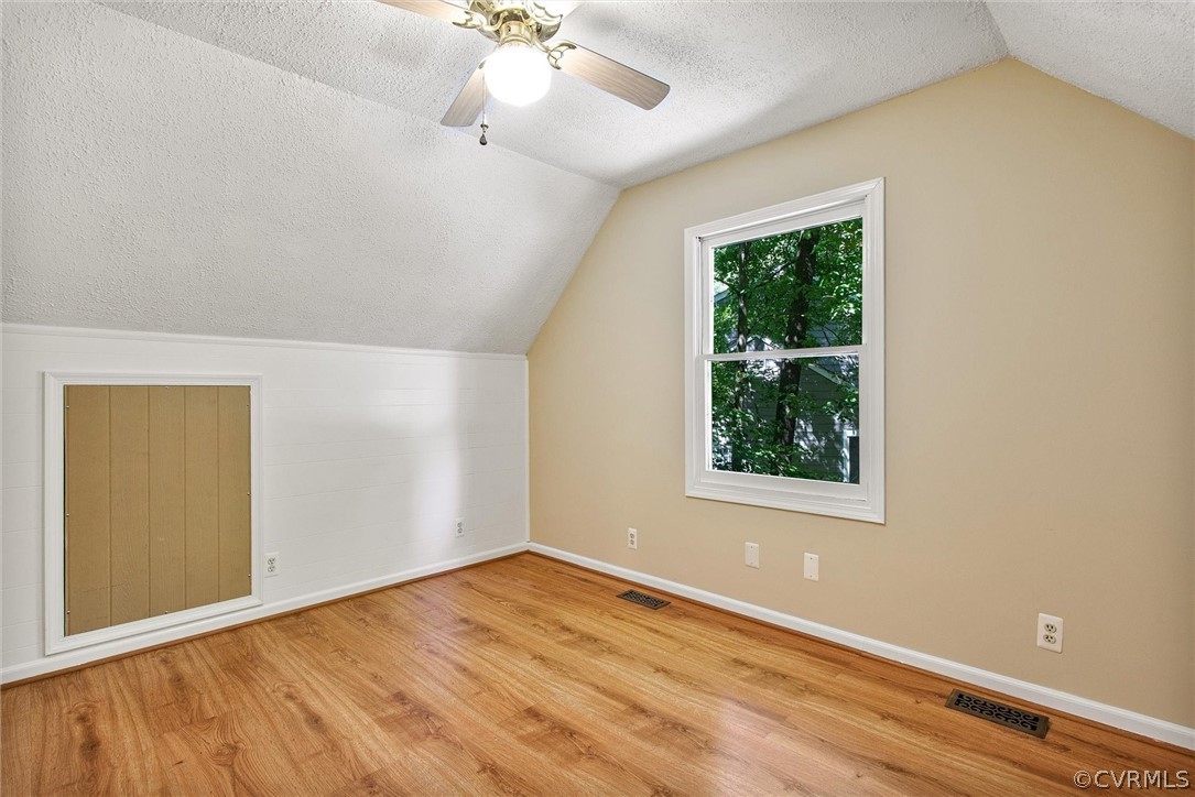 14000 Turtle Hill Road Midlothian, VA 23112 - Photo 26 of 37 an empty room with wooden floor fan and windows