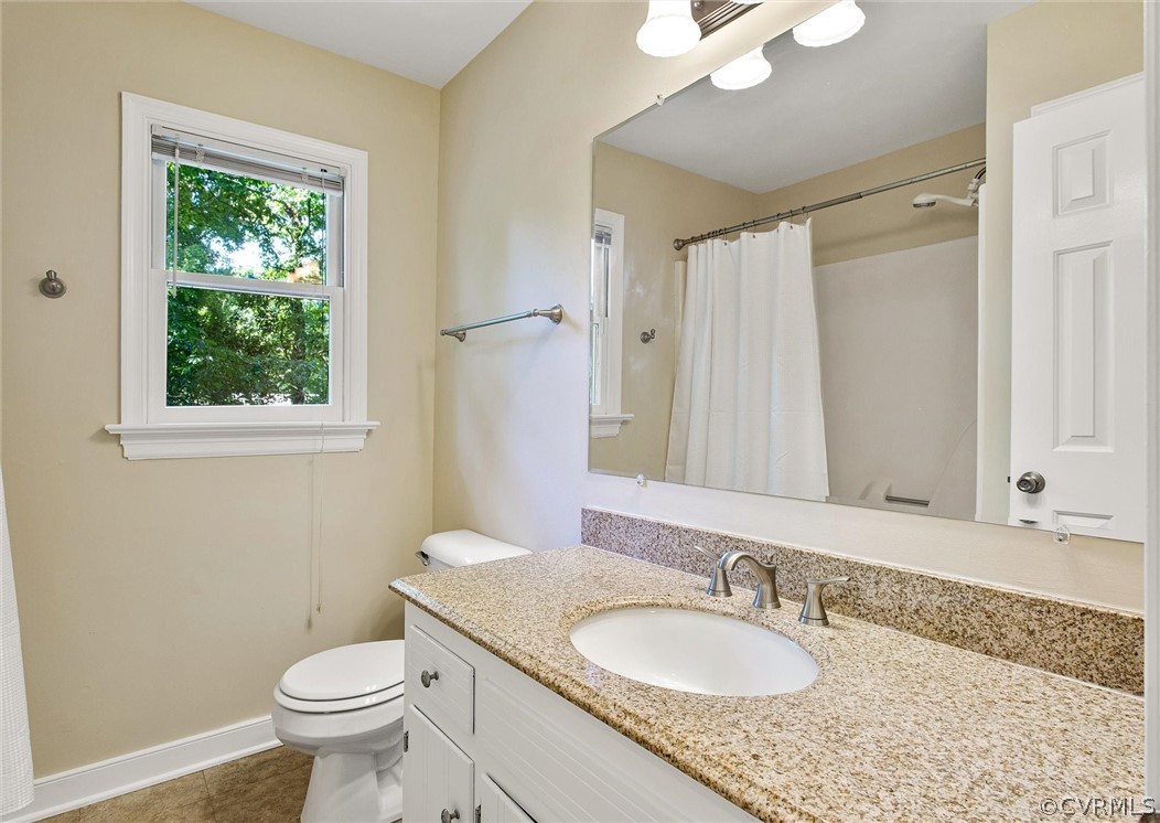 14000 Turtle Hill Road Midlothian, VA 23112 - Photo 27 of 37 a bathroom with a granite countertop sink toilet and a mirror