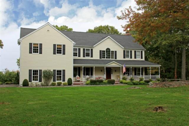 636 Barrack Hill Road Ridgefield, CT 06877 - Photo 1 of 1 a front view of a house with garden and trees