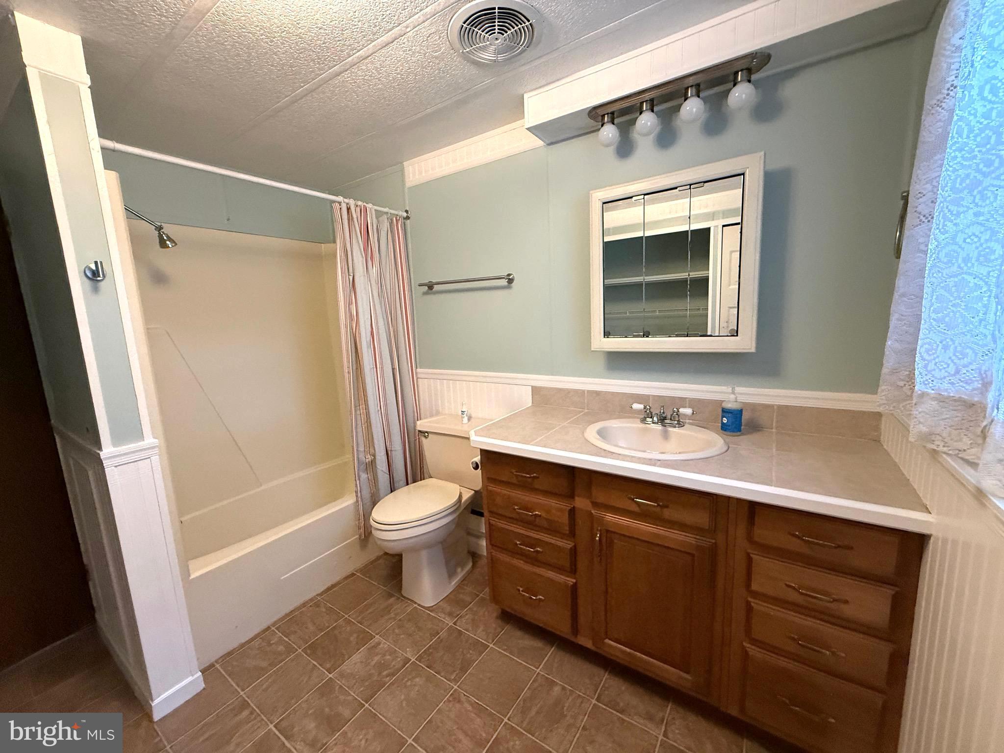 87 Holly Court Tabernacle, NJ 08088 - Photo 13 of 24 a bathroom with a sink a toilet a mirror and shower