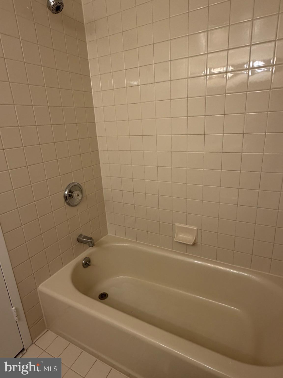 5225 Pooks Hill Road, Unit 1804N Bethesda, MD 20814 - Photo 12 of 44 Serene bathroom retreat with tiled elegance.