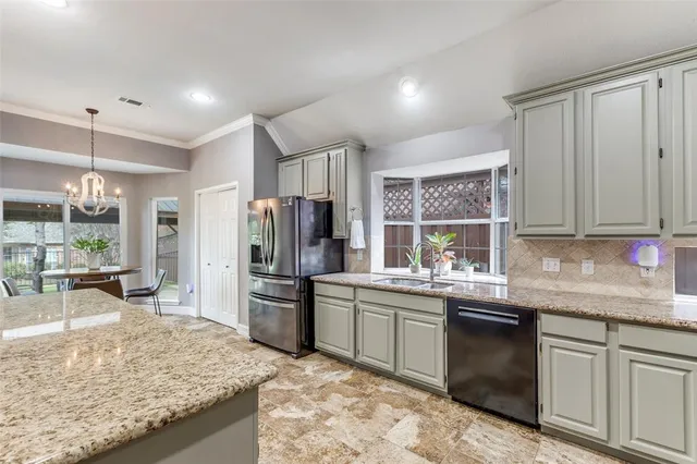 a kitchen with a sink stove and refrigerator