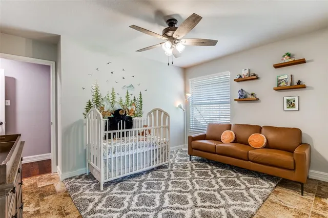 a bedroom with furniture and a chandelier