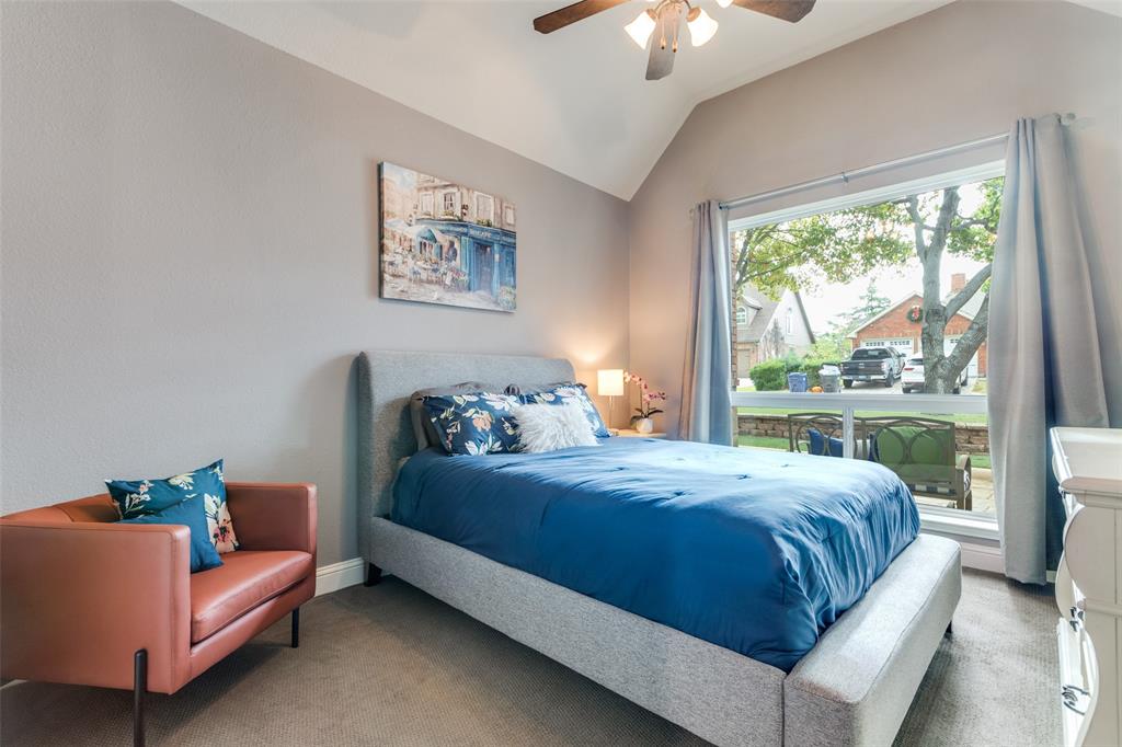2704 Wind Ridge McKinney, TX 75072 - Photo 20 of 35 2nd bedroom, featuring vaulted ceiling, new windows, ceiling fan and carpeting