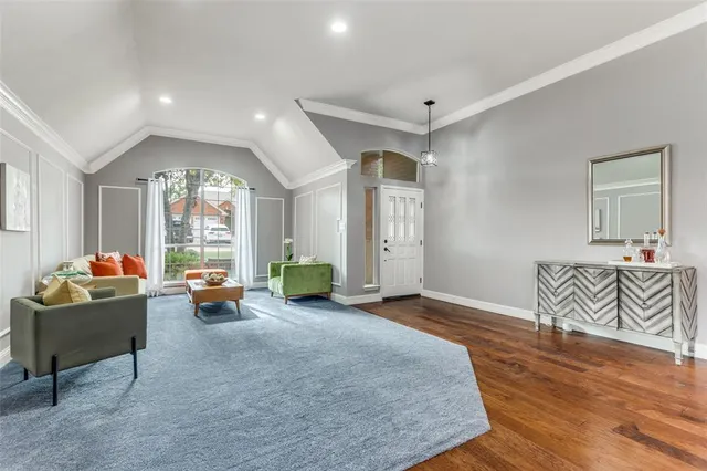 a living room with furniture and a table