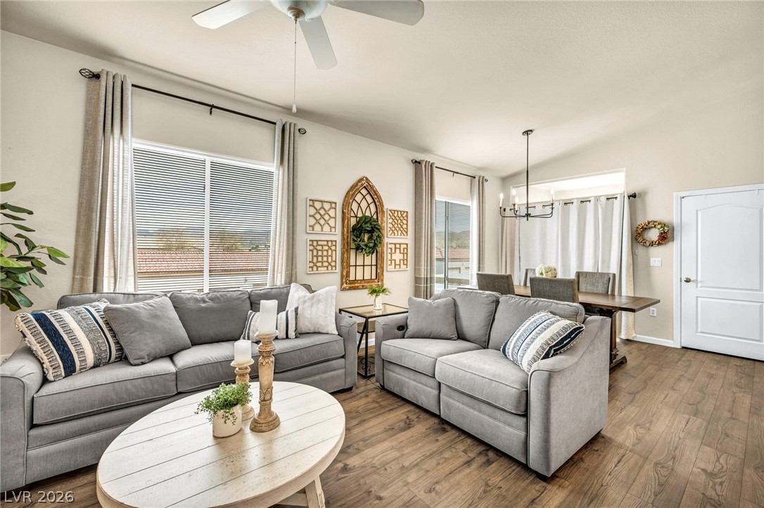 2305 West Horizon Ridge Parkway, Unit 3621 Henderson, NV 89052 - Photo 15 of 23 Hardwood floors stretch across this living space, offering warmth and continuity.
