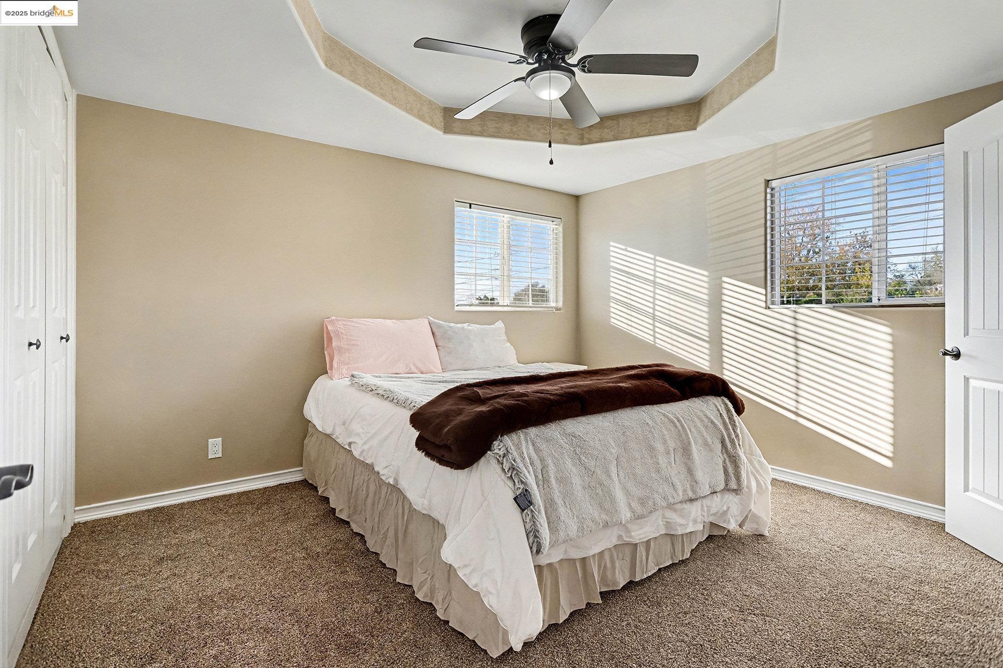 3614 Kay Court Fremont, CA 94538 - Photo 16 of 35 Bedroom featuring a raised ceiling, carpet, a ceiling fan, a closet and private en suite bathroom