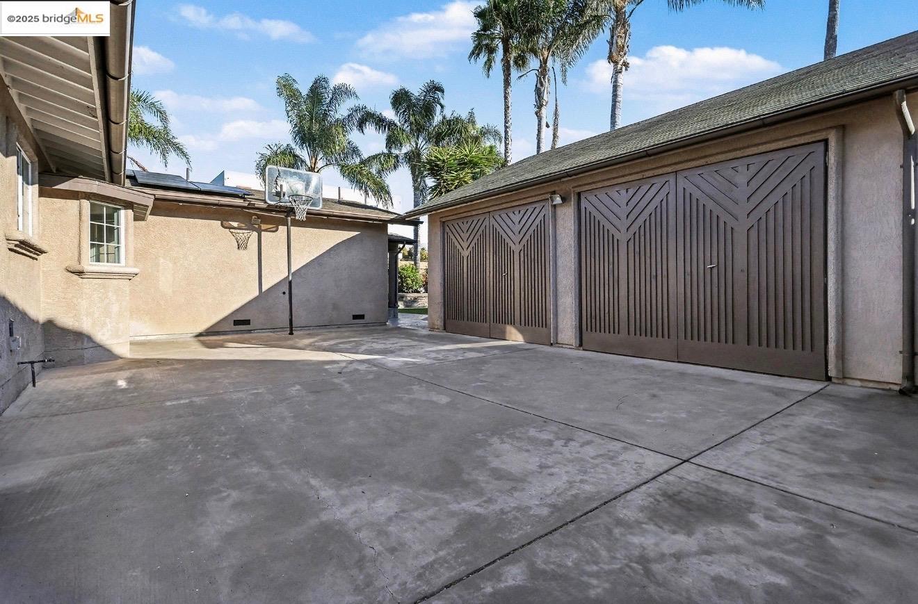 3614 Kay Court Fremont, CA 94538 - Photo 25 of 35 View of patio / terrace with basketball and detached 3 car garage/workshop ADU potential with water and electrical