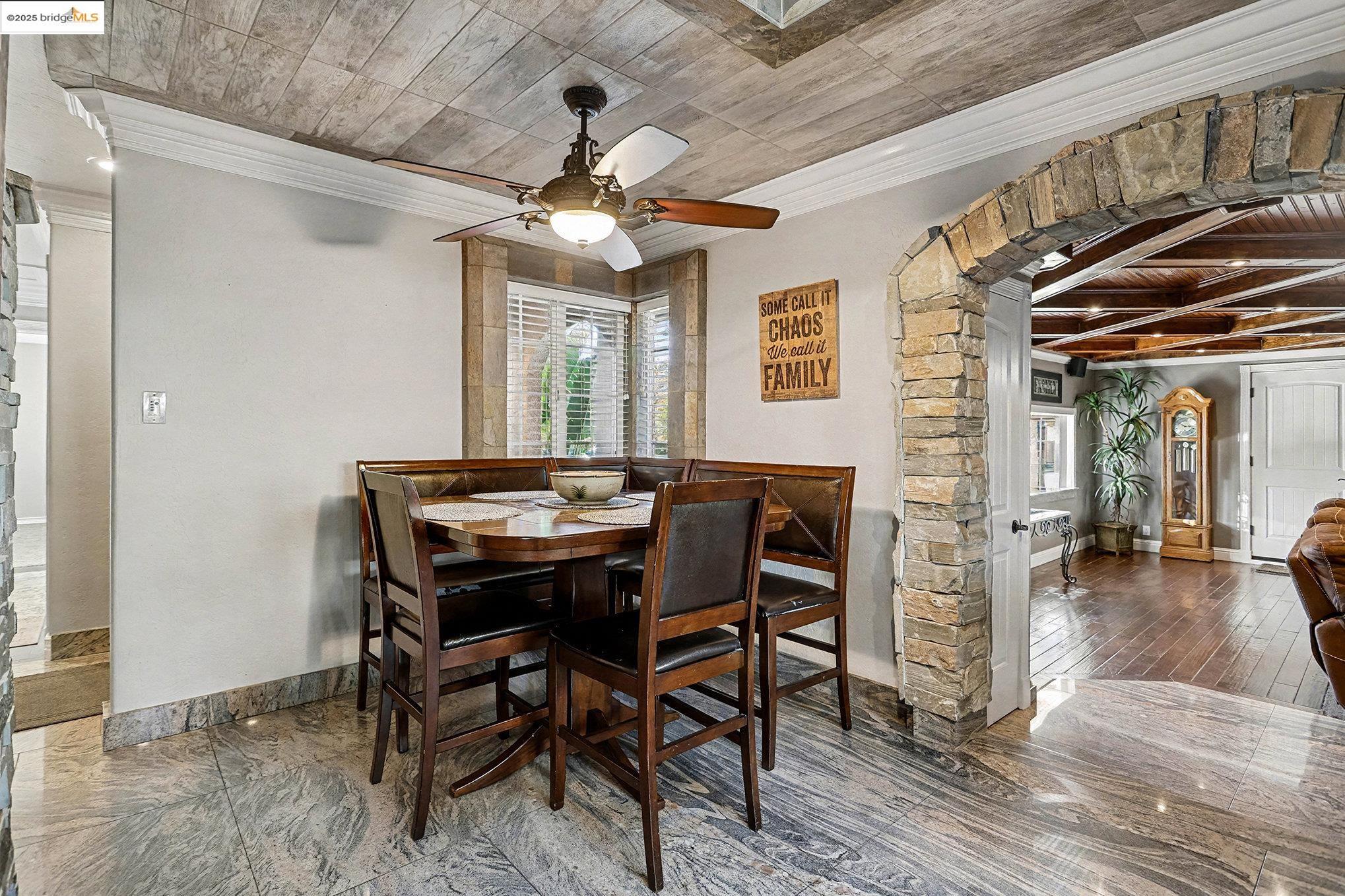 3614 Kay Court Fremont, CA 94538 - Photo 5 of 35 Dining area with arched doorways, crown molding, wood tile ceiling and granite floors