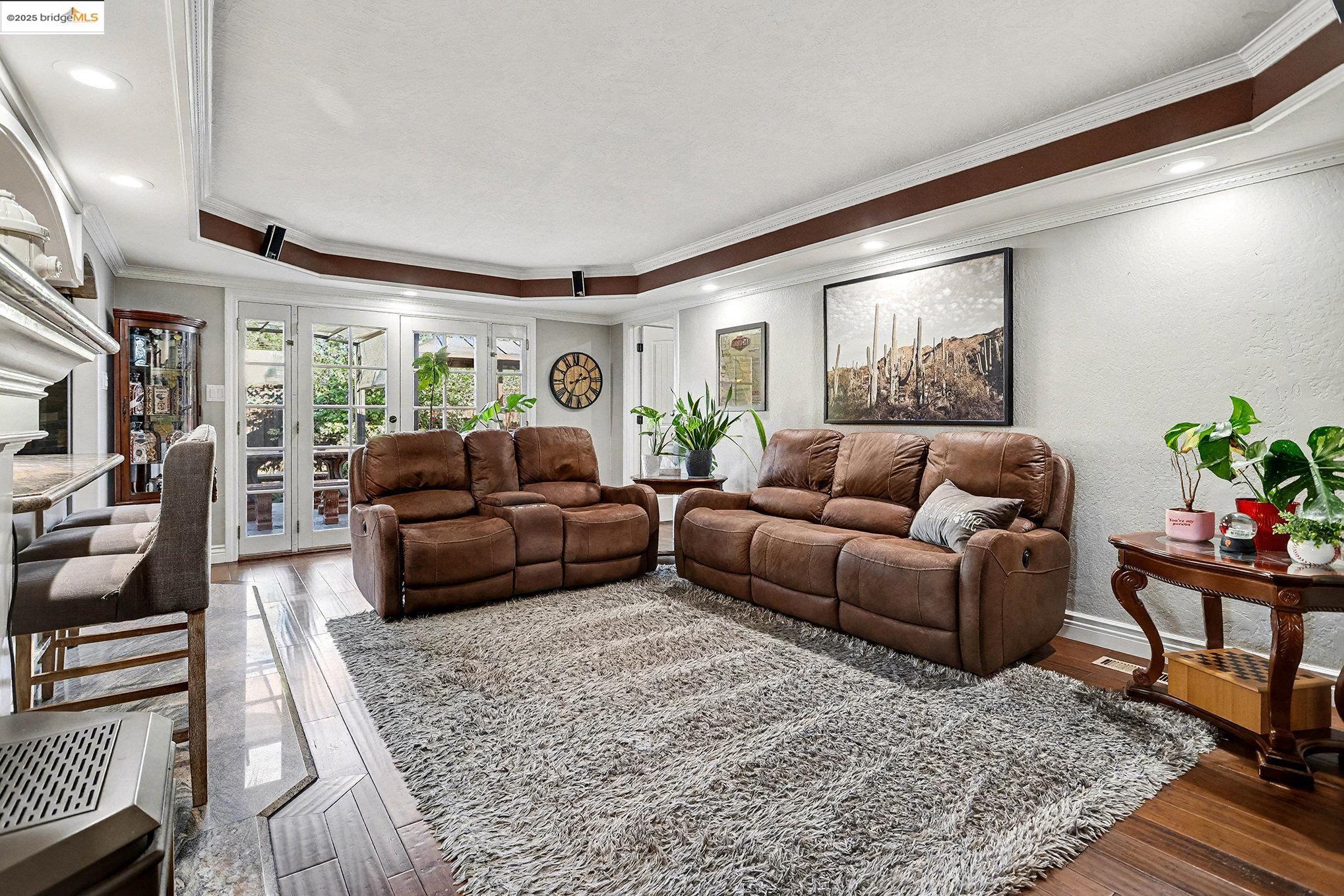 3614 Kay Court Fremont, CA 94538 - Photo 6 of 35 Living area with ornamental molding, bamboo floors, a raised ceiling, and french doors