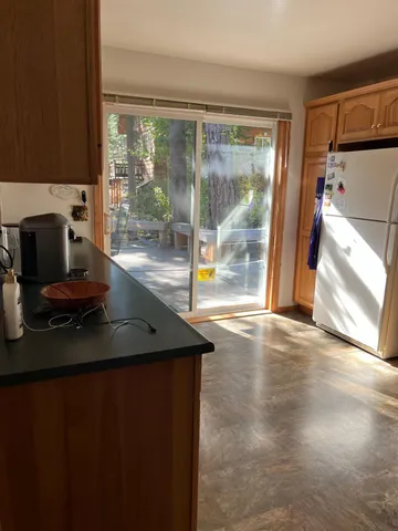 a view of a room that has a large window