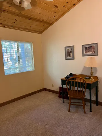 a bedroom with furniture and a window