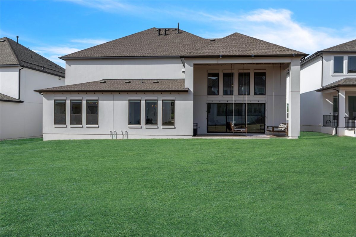 2312 Mondello Path Leander, TX 78641 - Photo 4 of 40 Rear view of property featuring a yard, a patio, and a shingled roof