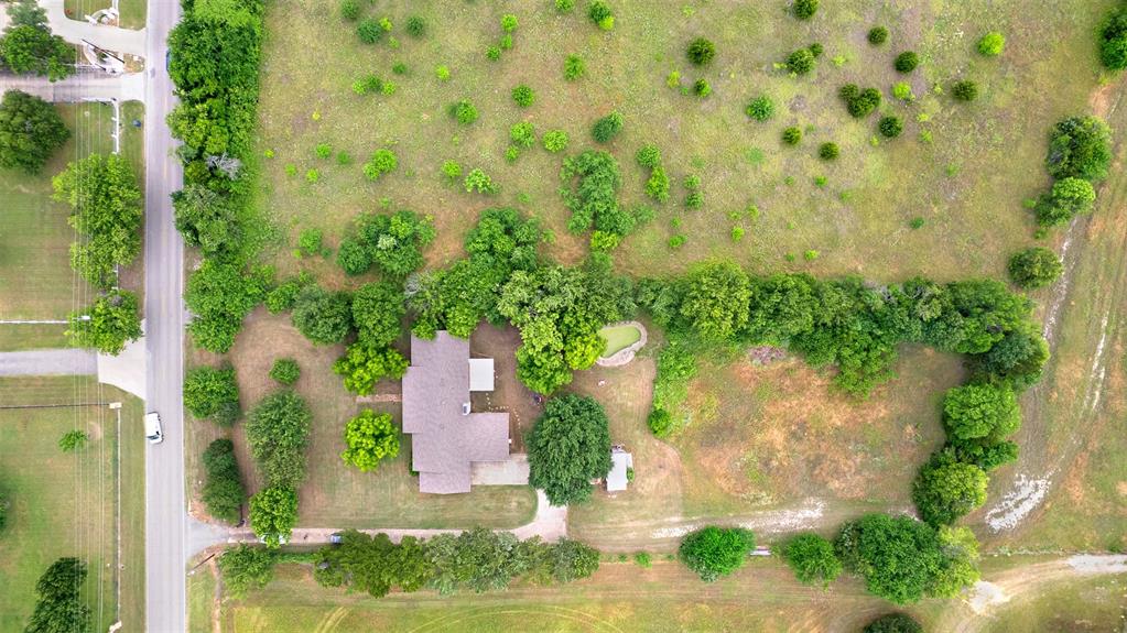 1415 South Joe Wilson Road Cedar Hill, TX 75104 - Photo 8 of 17 an aerial view of a house with pool outdoor seating and yard