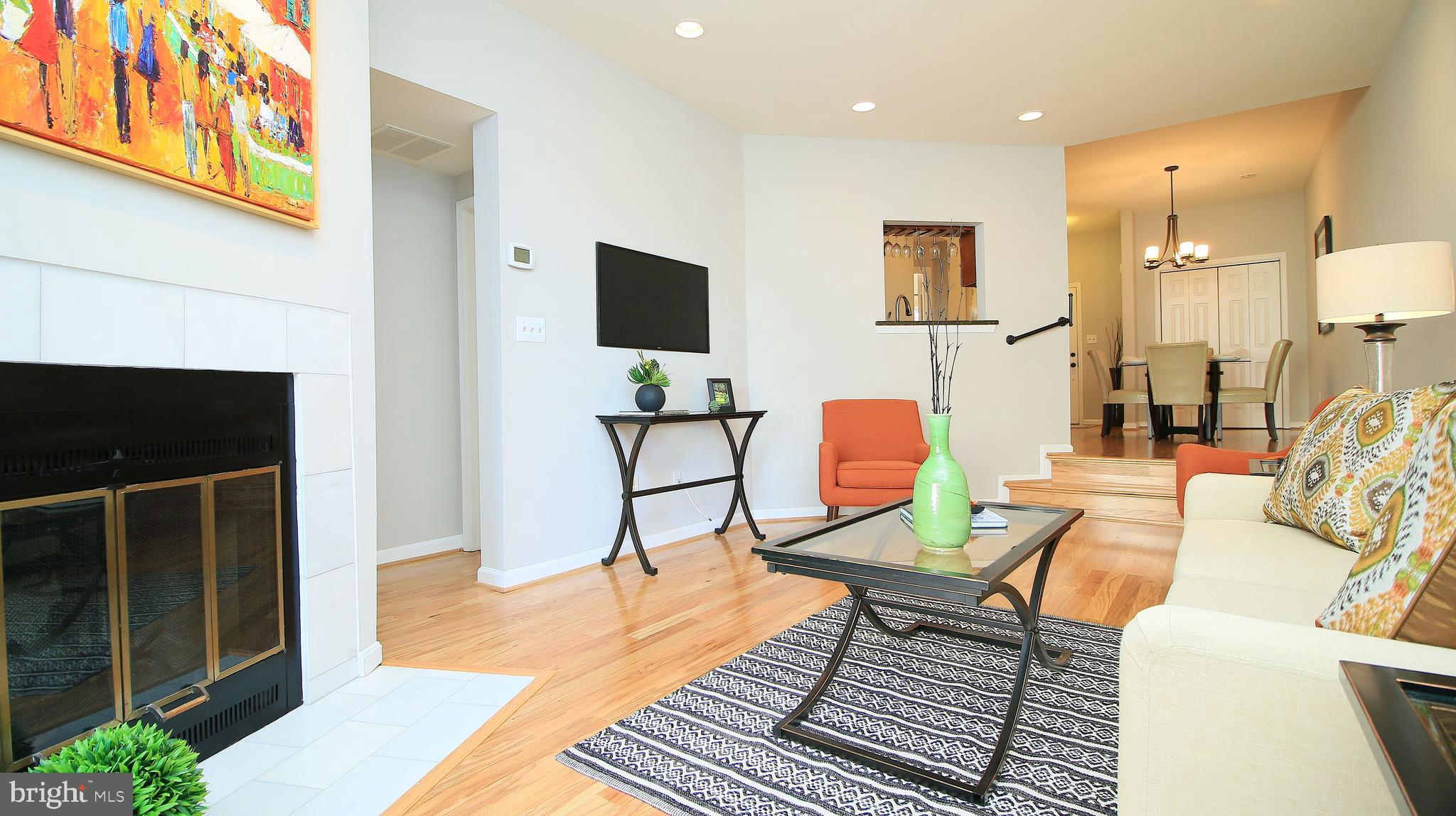 11226 Harbor Court Reston, VA 20191 - Photo 6 of 30 WOOD-BURNING FIREPLACE IN LR