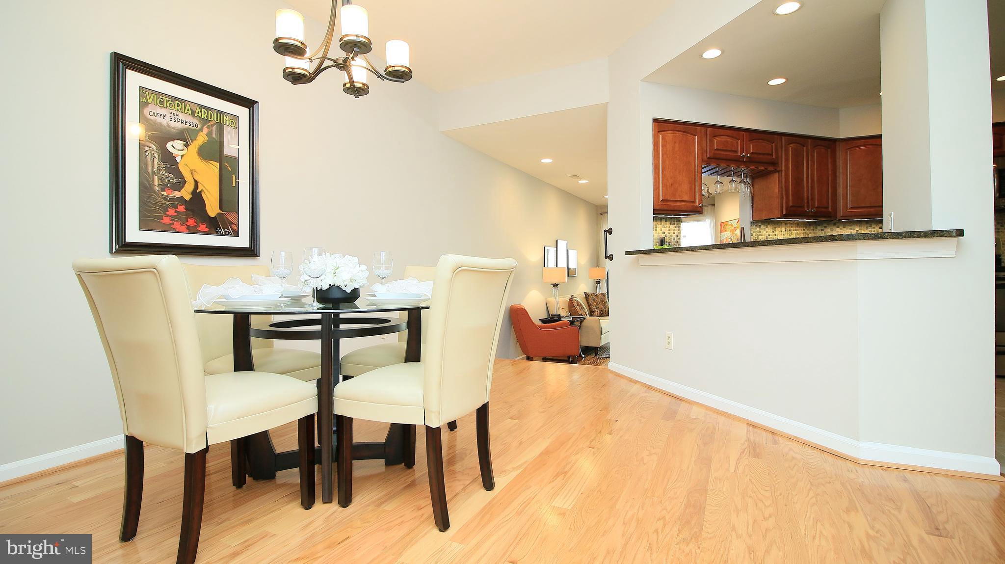 11226 Harbor Court Reston, VA 20191 - Photo 9 of 30 BREAKFAST BAR BETWEEN KITCHEN & DINING ROOM