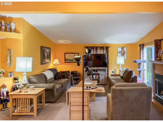 a dining room with furniture a chandelier and wooden floor