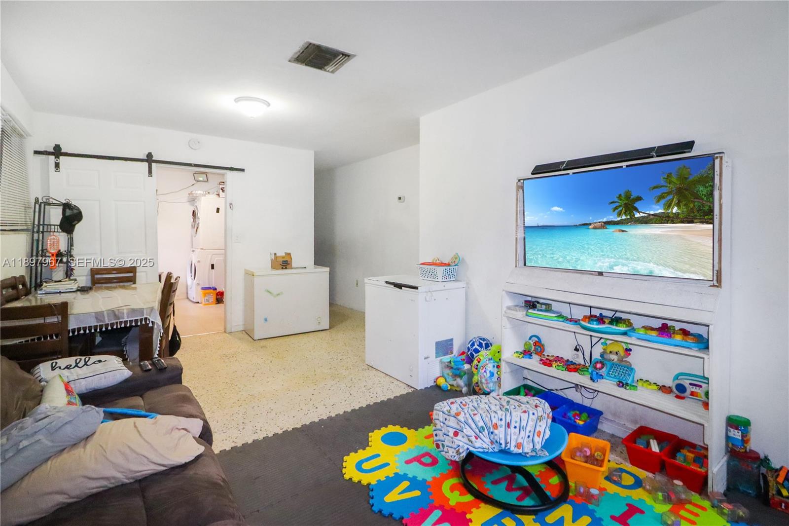 333 Southwest 30th Avenue Miami, FL 33135 - Photo 15 of 27 a living room with furniture and a baby crib
