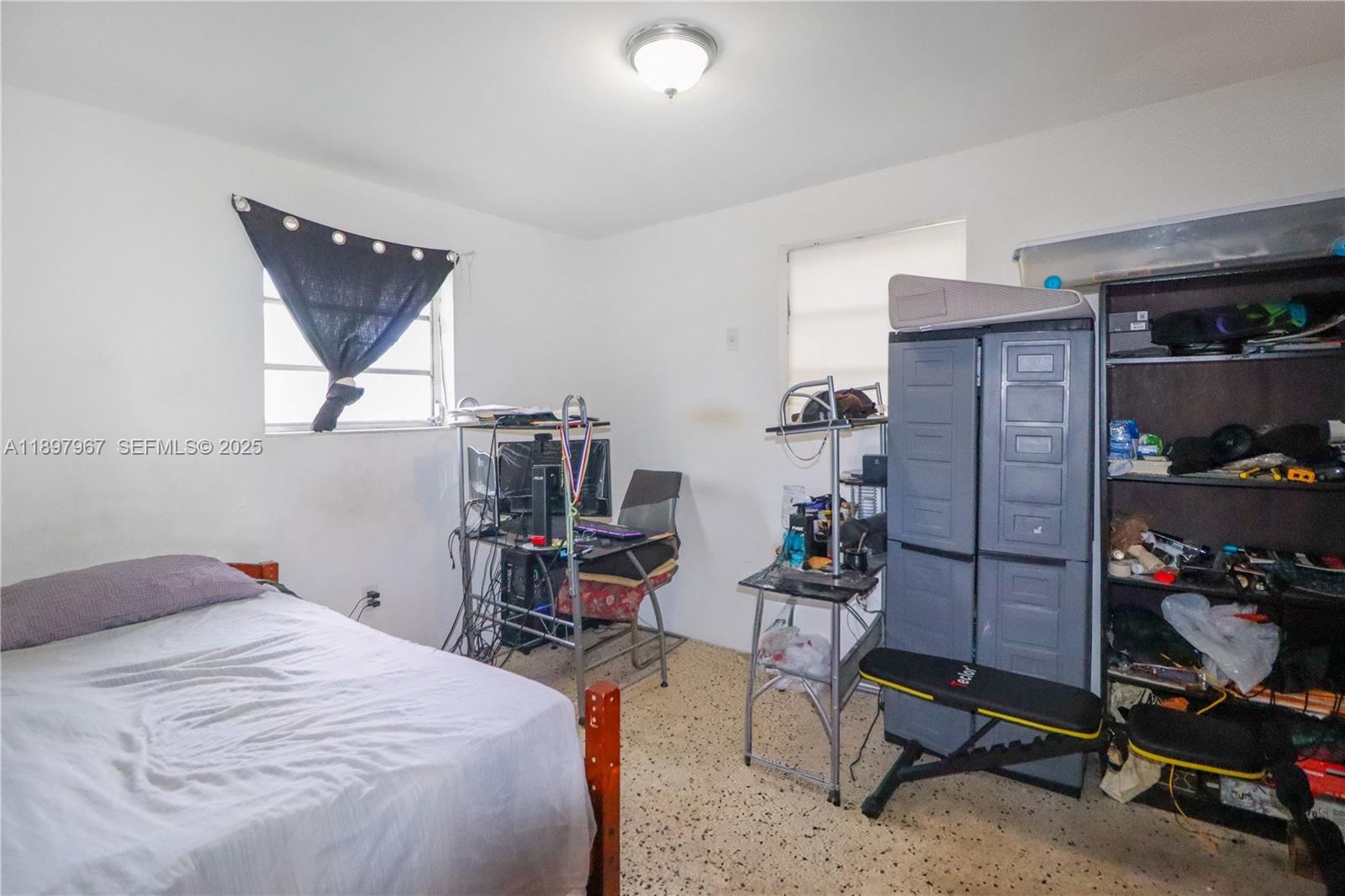 333 Southwest 30th Avenue Miami, FL 33135 - Photo 19 of 27 a bedroom with a bed and a window