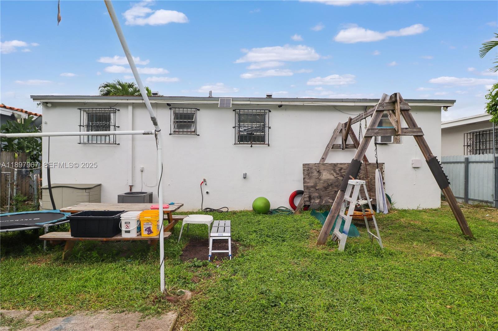 333 Southwest 30th Avenue Miami, FL 33135 - Photo 24 of 27 a backyard of a house with table and chairs
